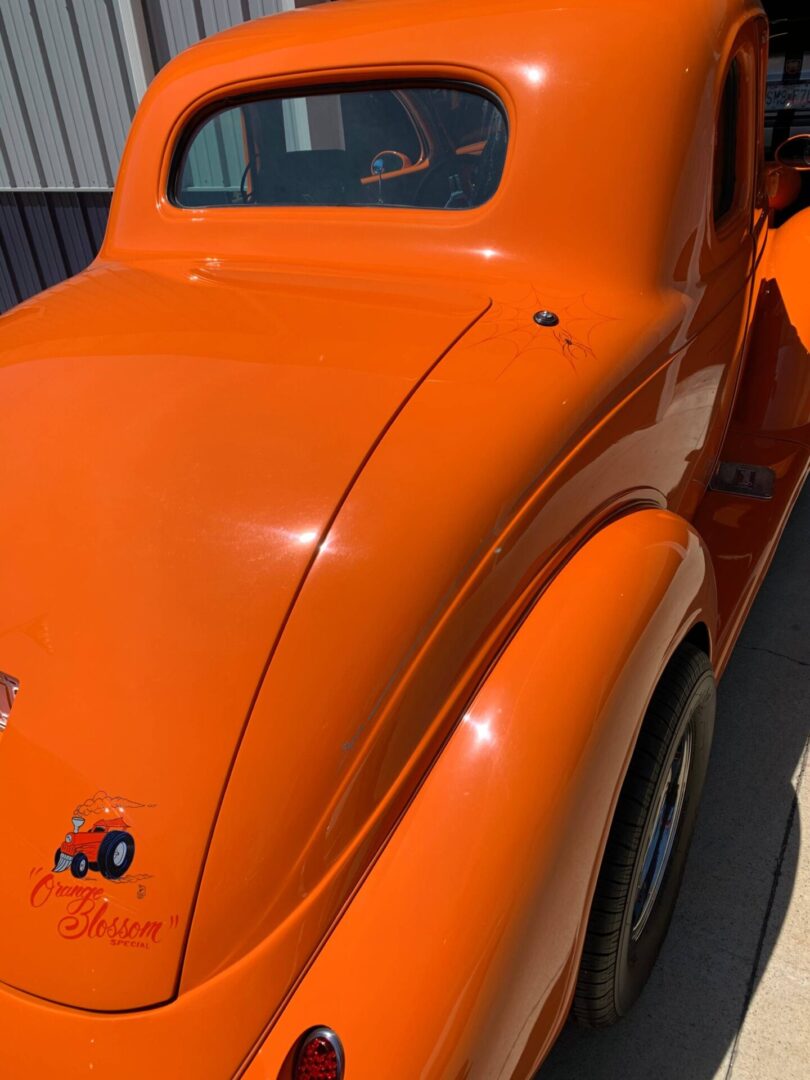 The back of an orange blossom car
