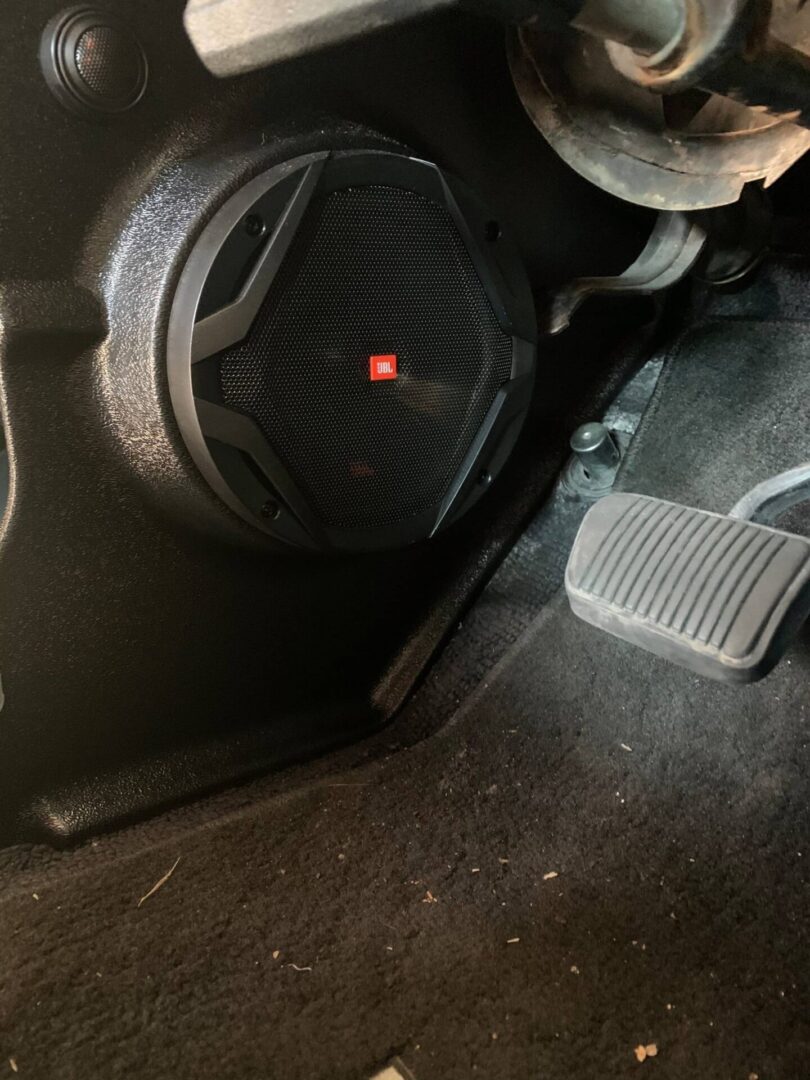 A brake and JBL stereo speaker of a car