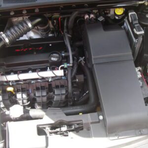 A black caliber coil cover for an auto part