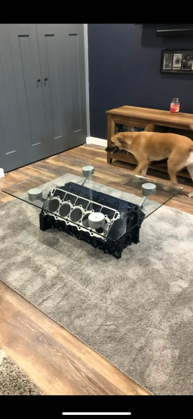 A use of machine part as table, with dog