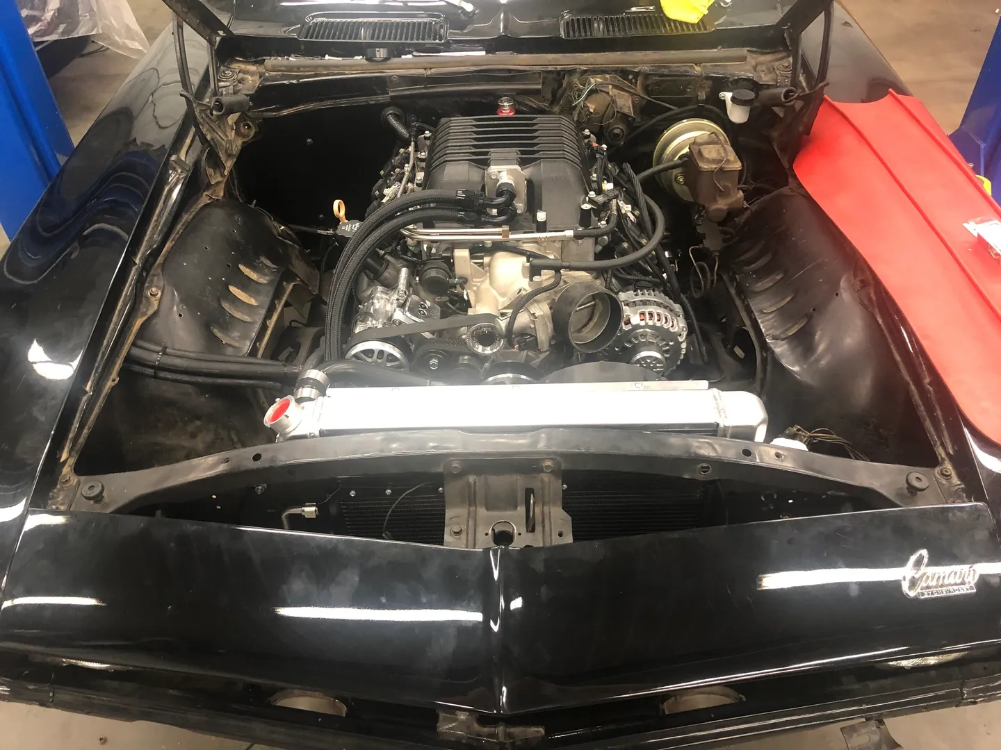 A camaro hood engine opened at the shop