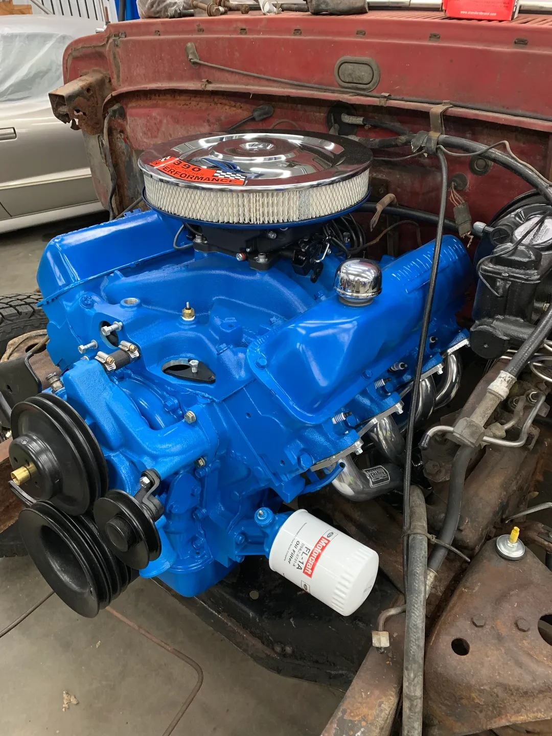 A blue, machine, side view, custom auto part