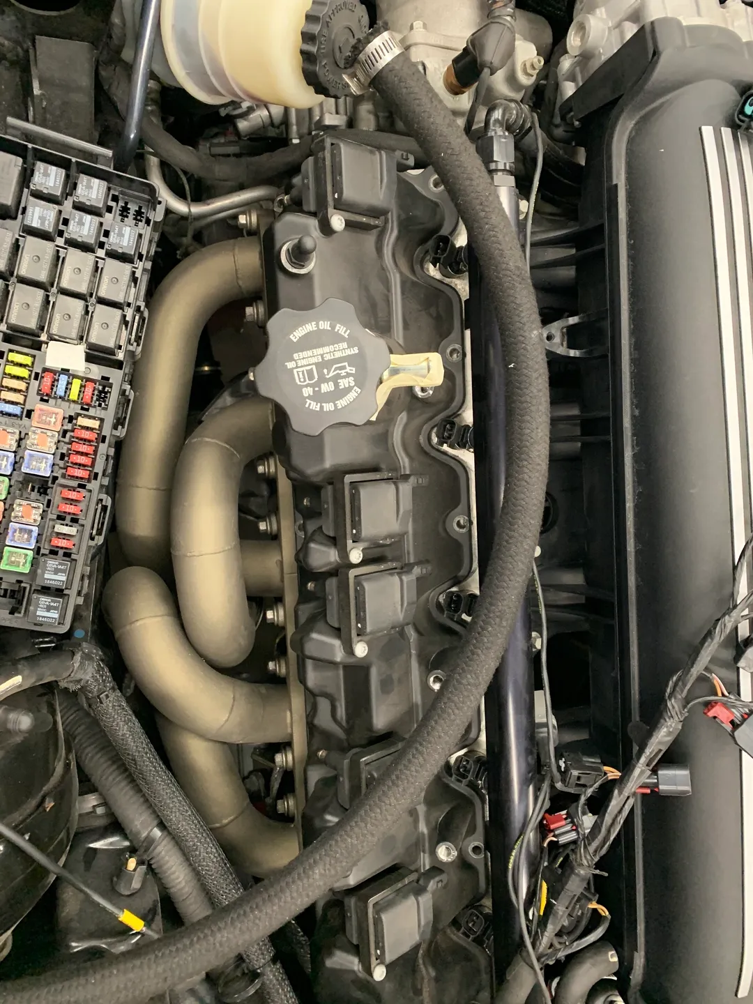 The cover of a car engine in the hood