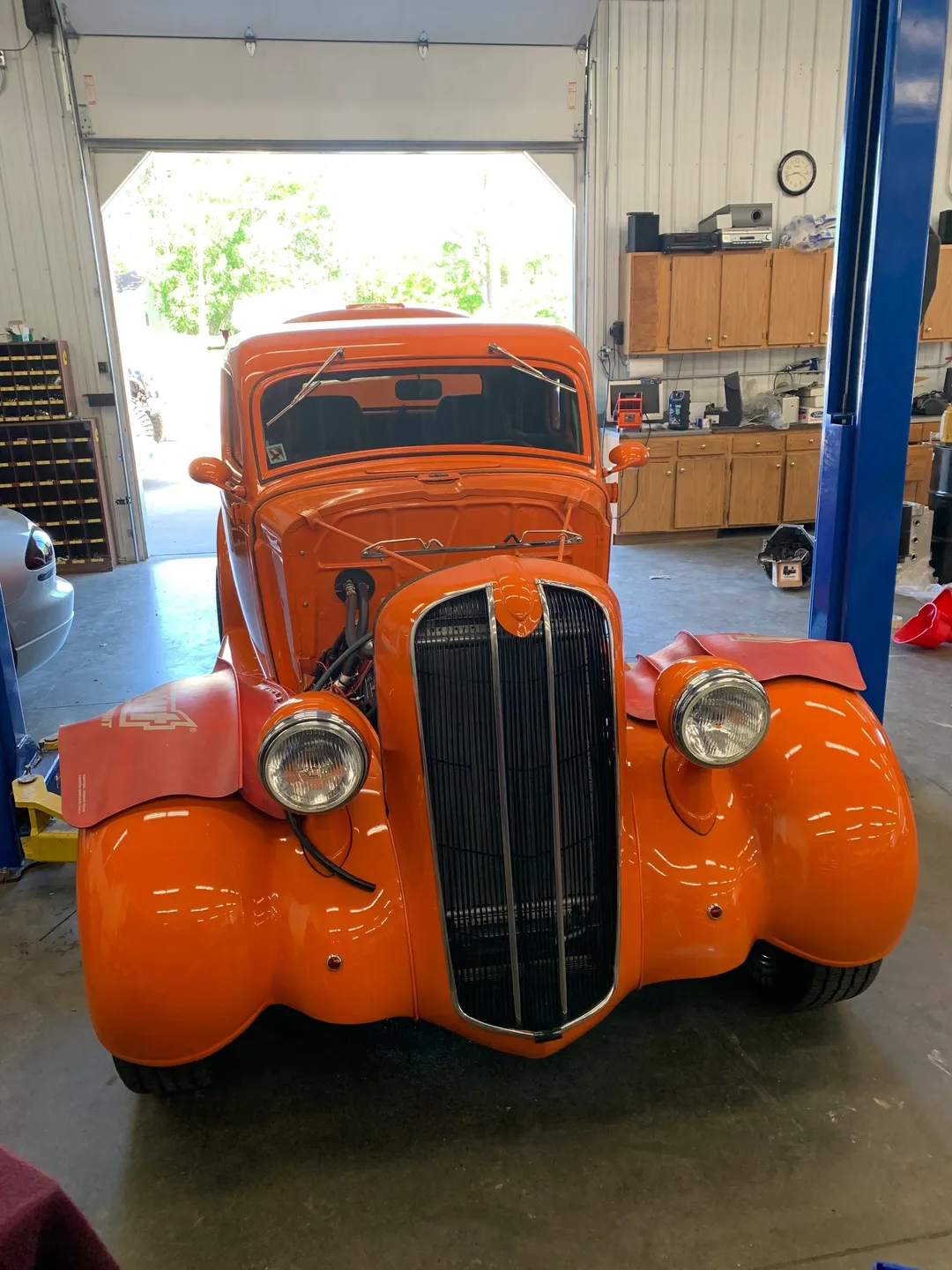 The front view of an orange vintage car