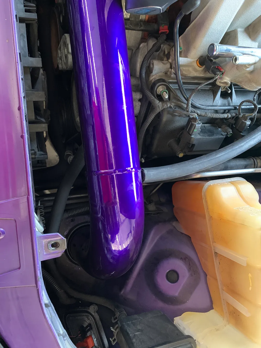 A hemi, purple fabricated auto parts