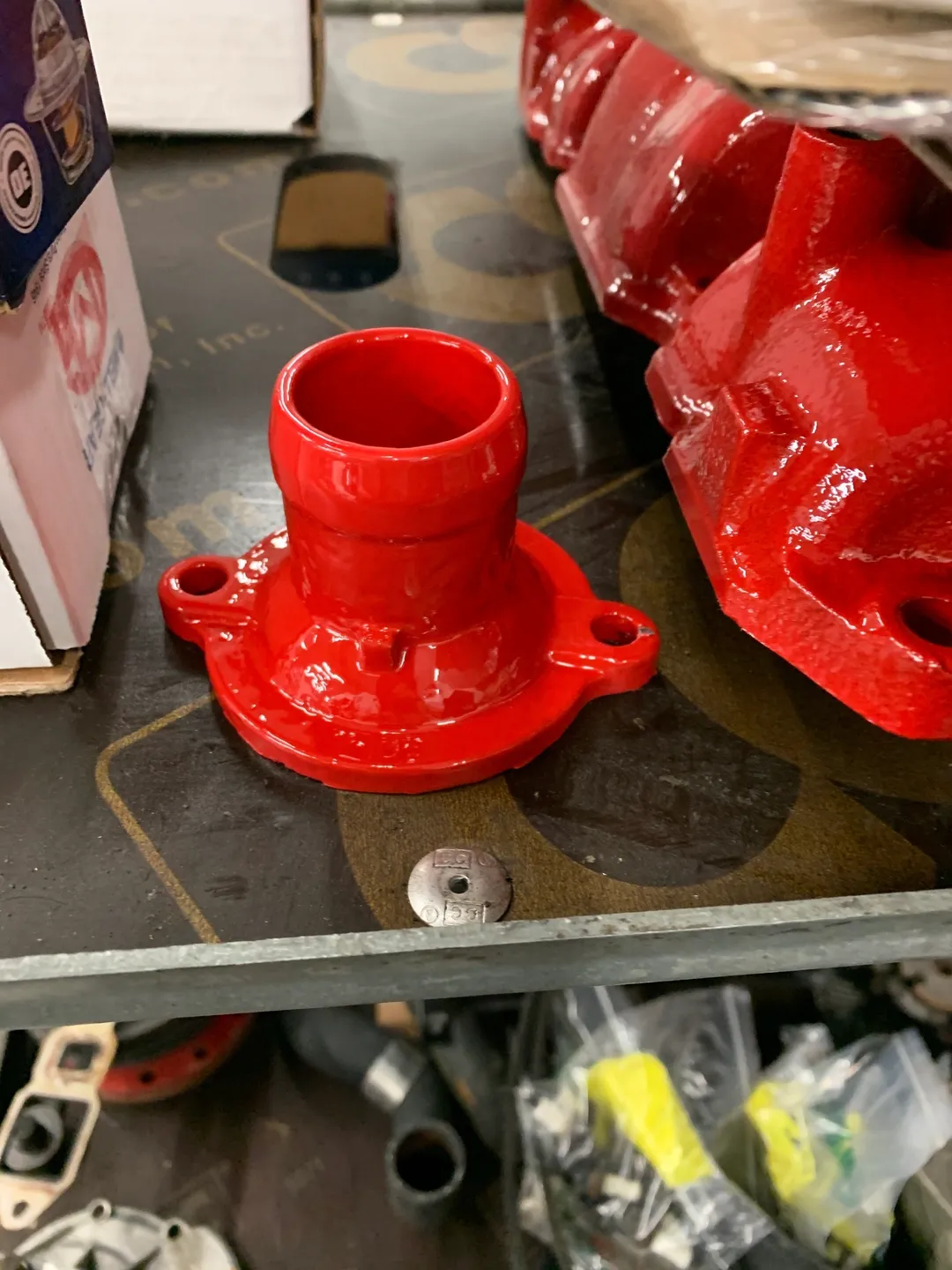 A small part of a car, cherry red