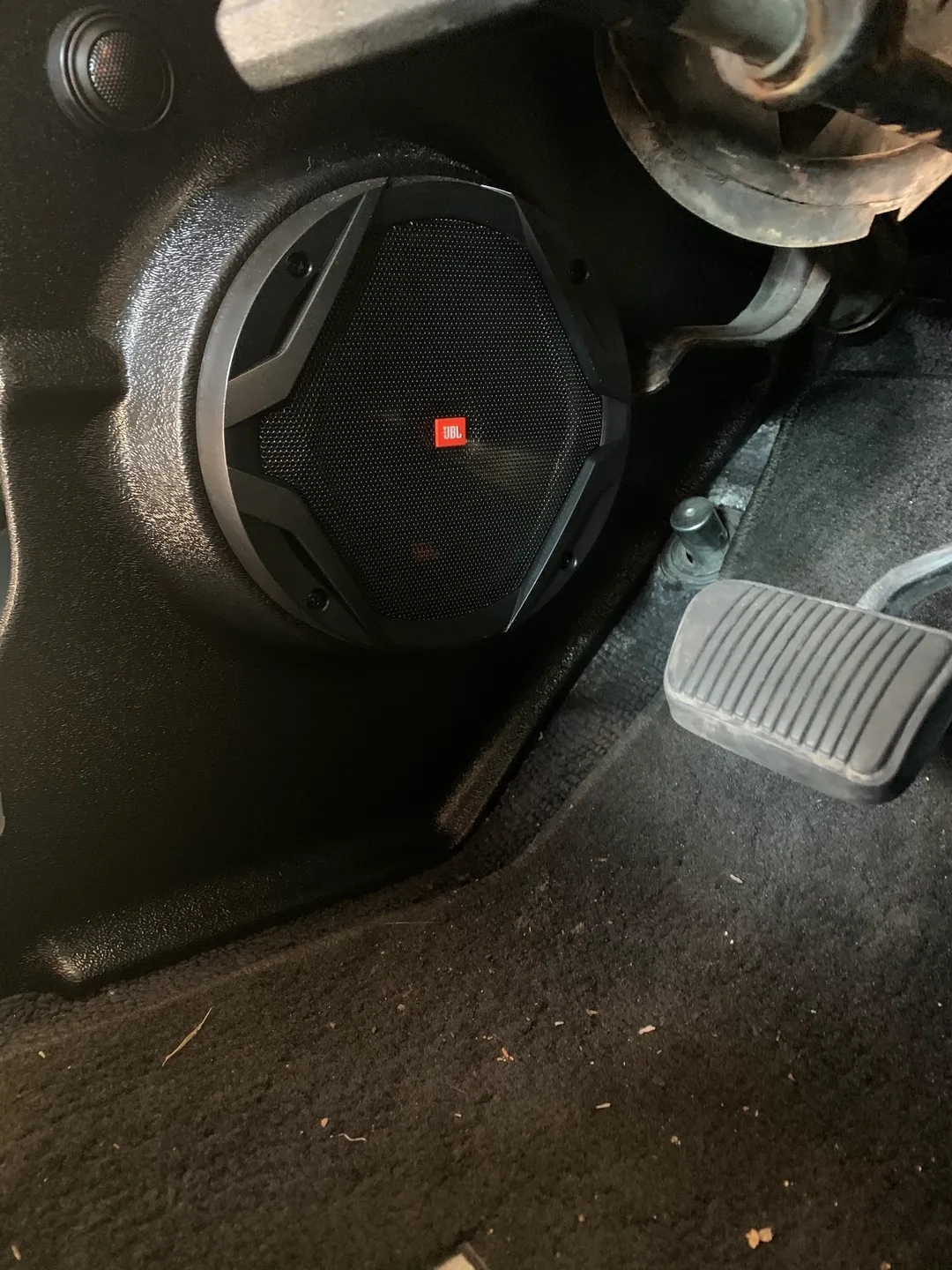 A JBL stereo speaker near the car chair
