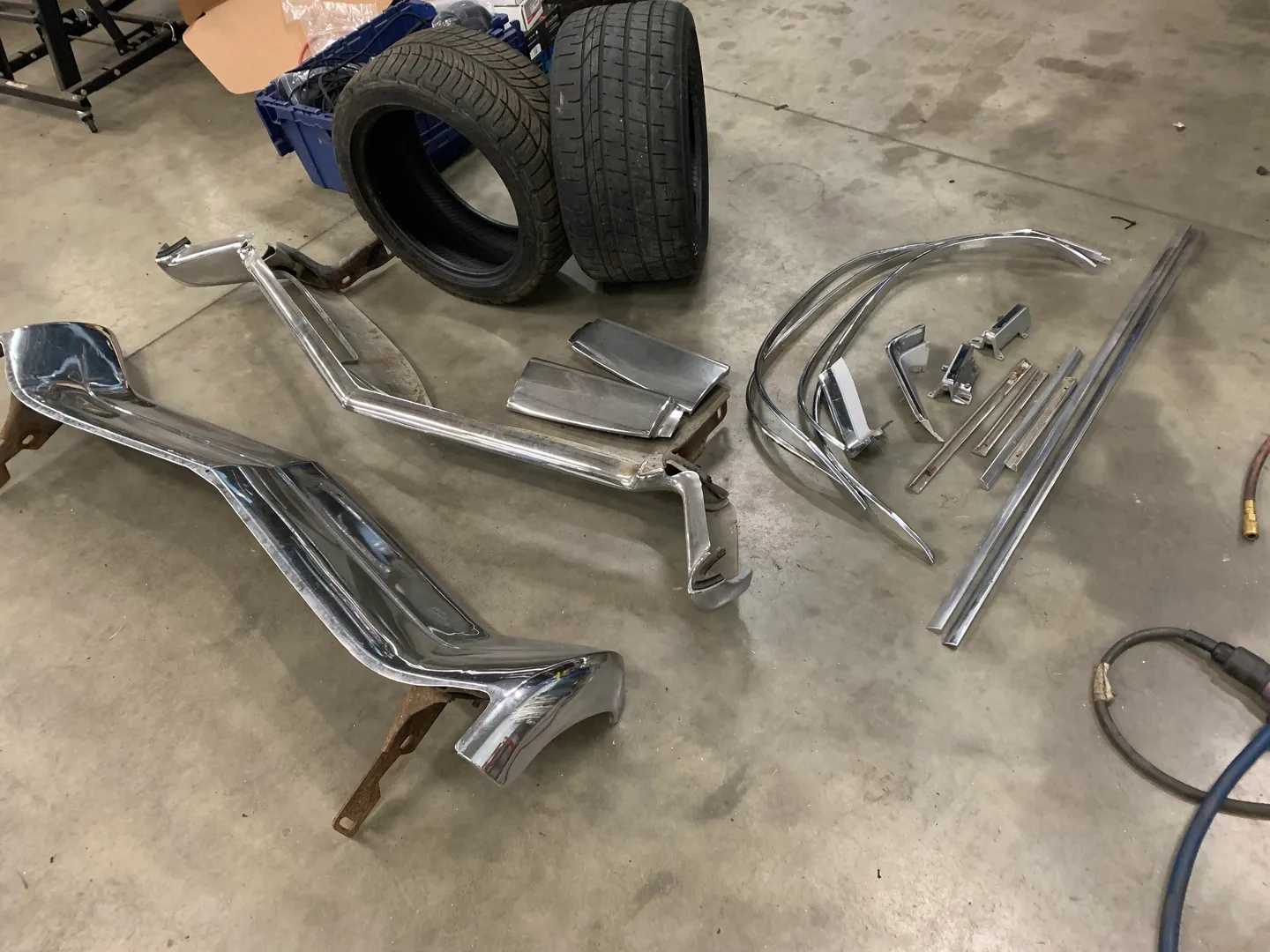 A set of silver parts for a vintage car