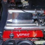 A red and silver viper valve cover part