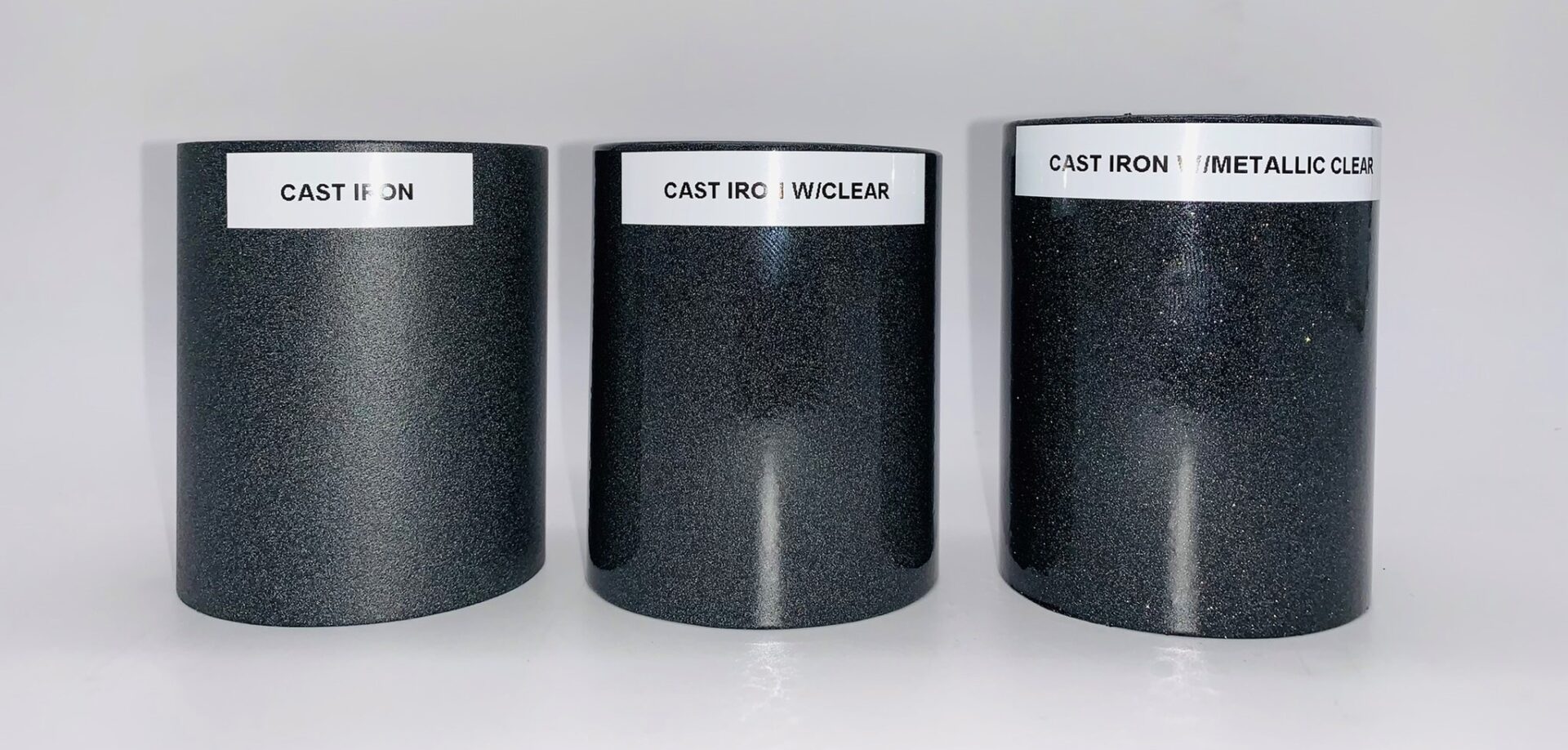 A set of three cast iron metallic clear parts