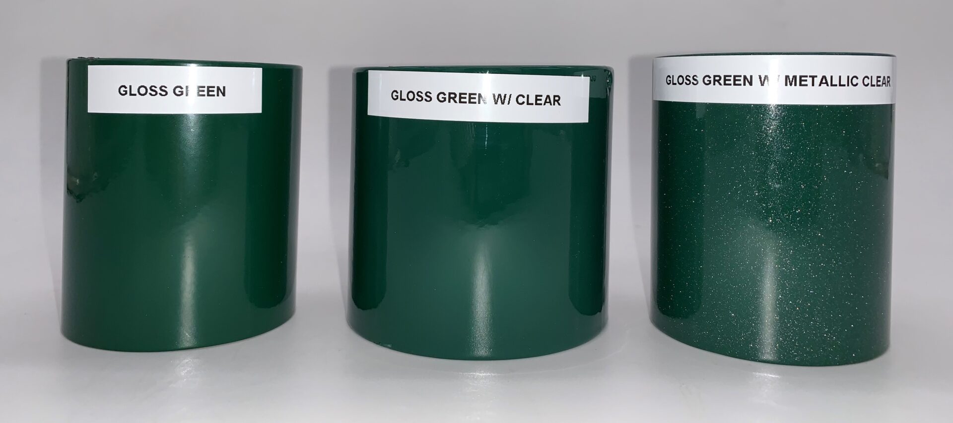 Three gloss green parts with a metal base