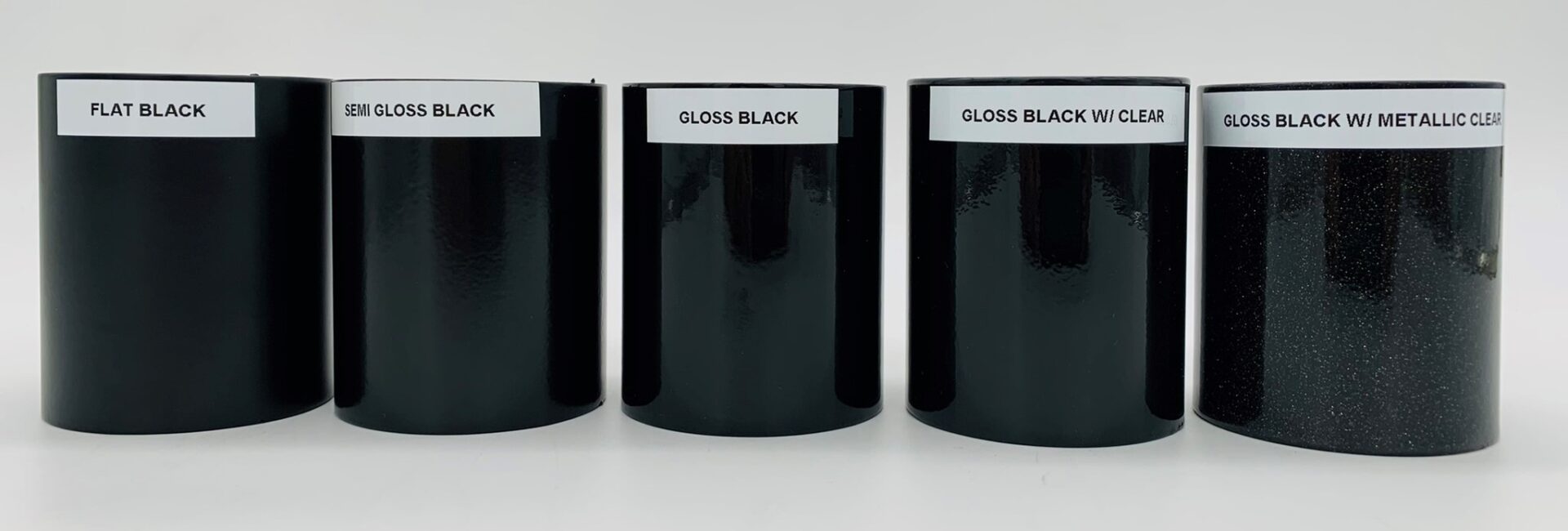 Three flat black, semi gloss, and gloss black