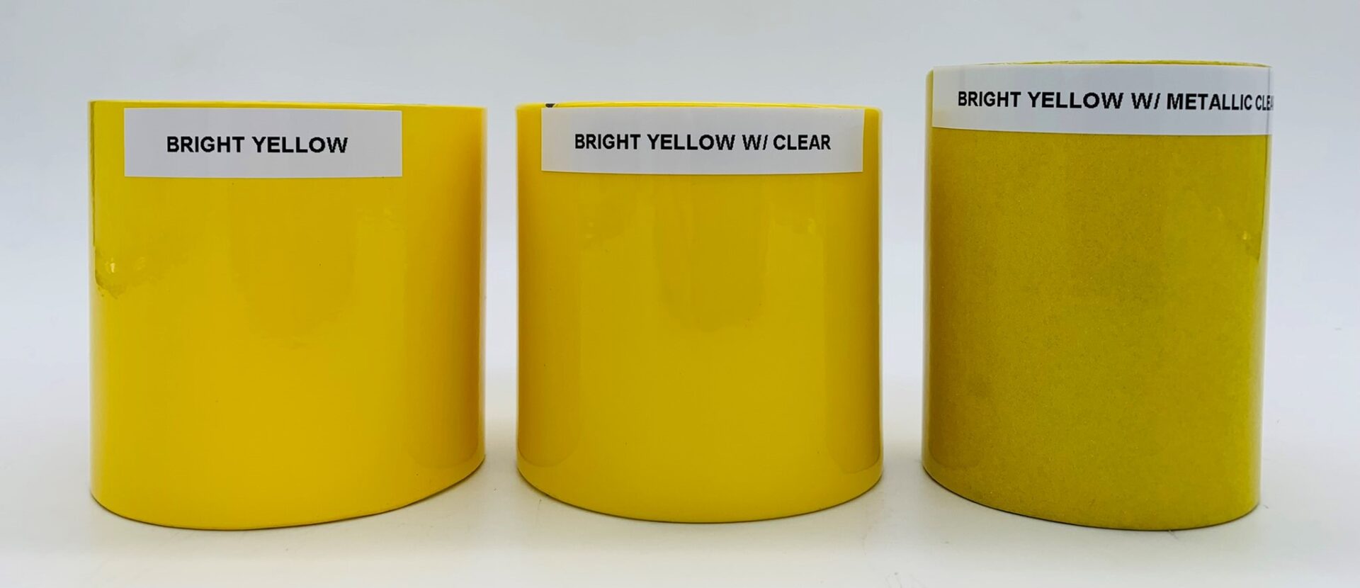 Three bright yellow tubes with metallic