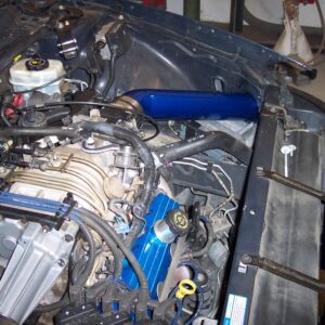 A blue and black engine part for the car