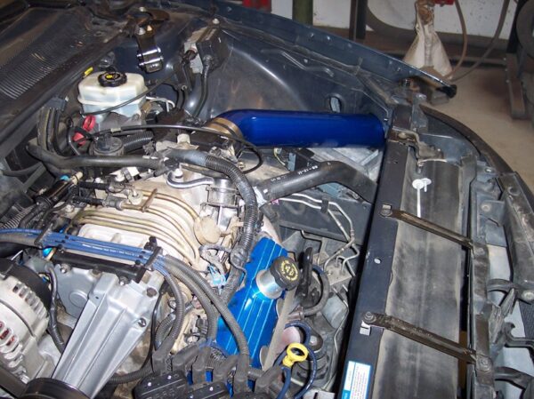 A blue and black engine part for the car